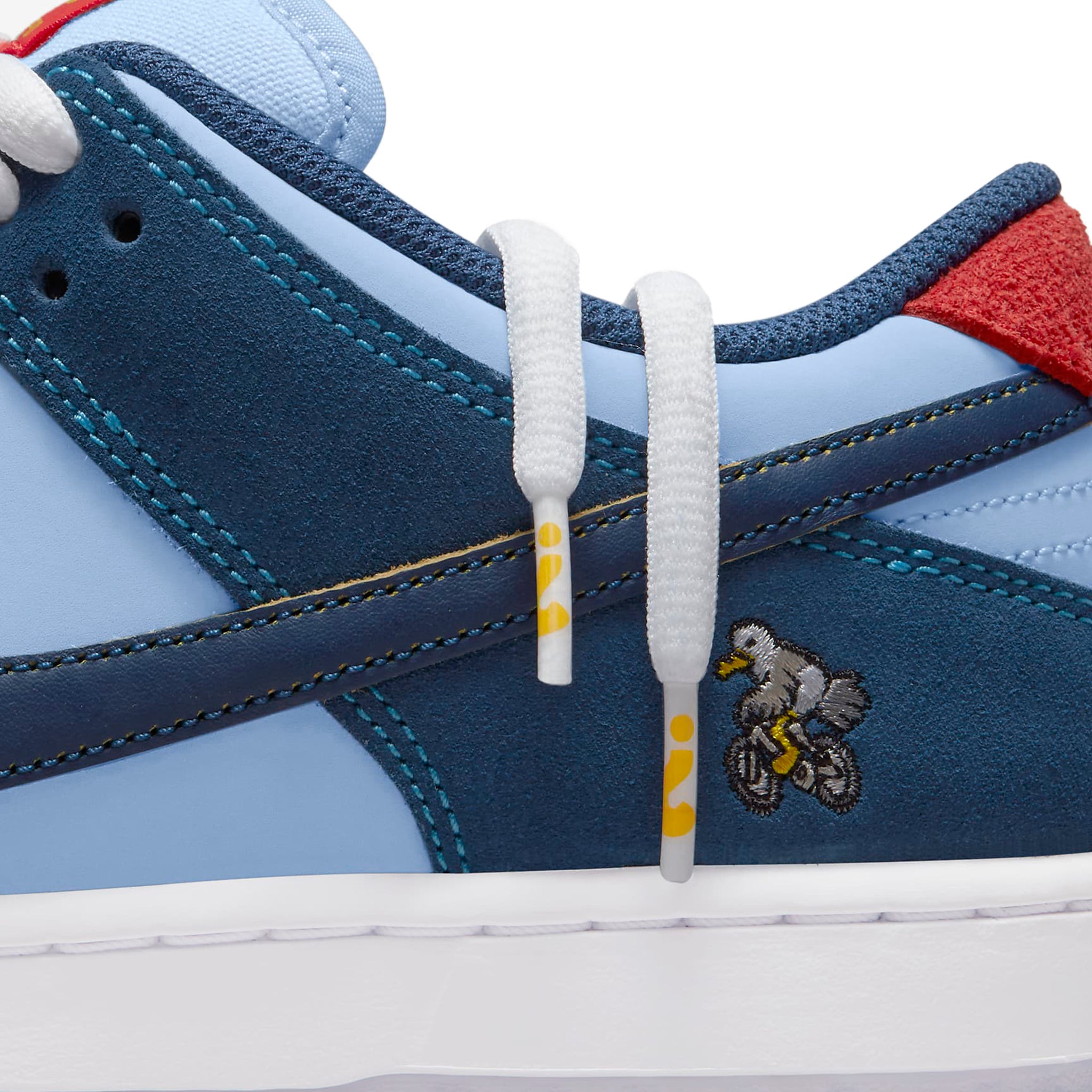 Side logo view of Nike SB Dunk Low Pro Why So Sad? DX5549-400